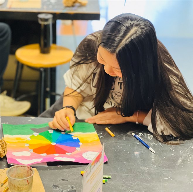  Student completing a color wheel project for art class